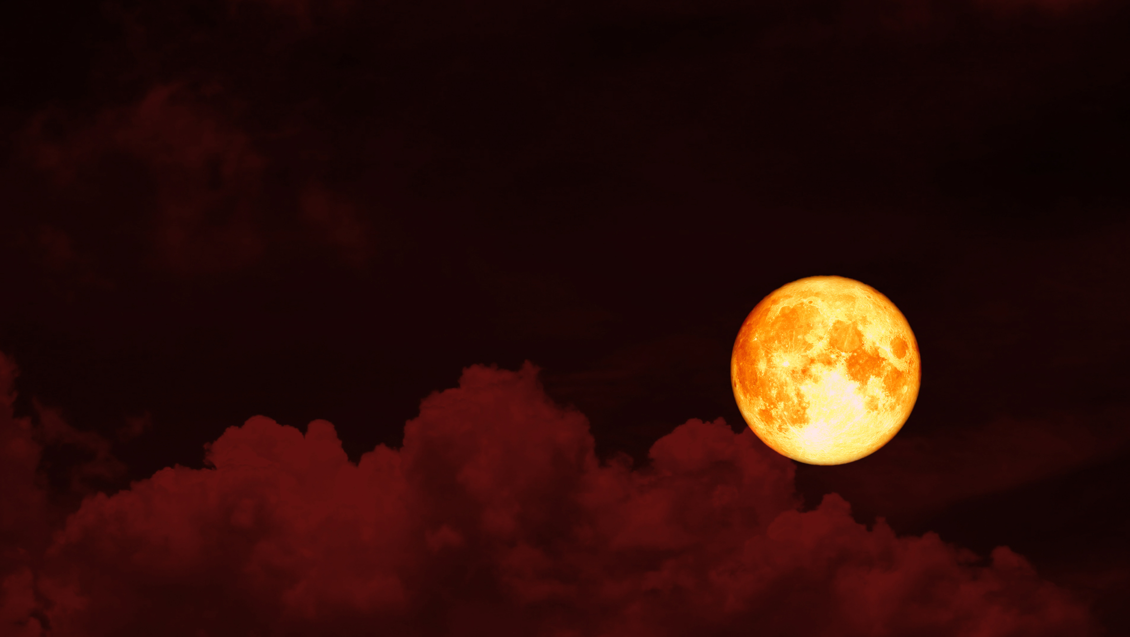 A blood moon in the red night sky.