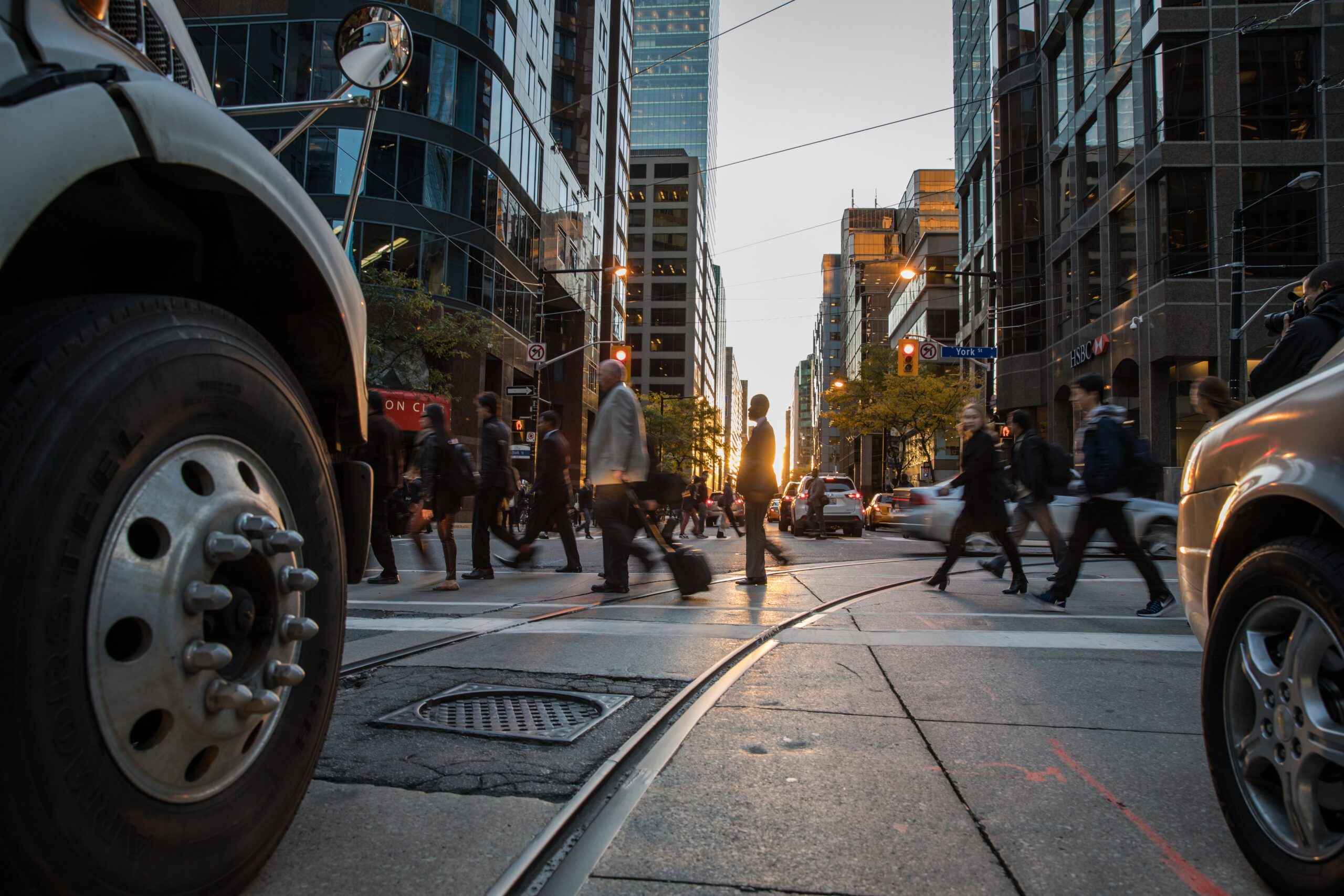 People crossing a busy street in Toronto, Canada.